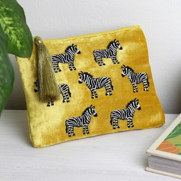 yellow velvet pouch with black and white zebras