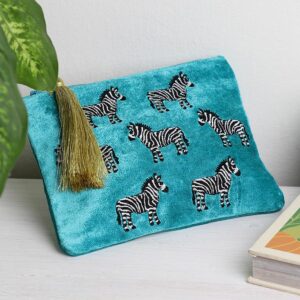 Turquoise blue velvet pouch embroidered with zebras finished with a gold tassle