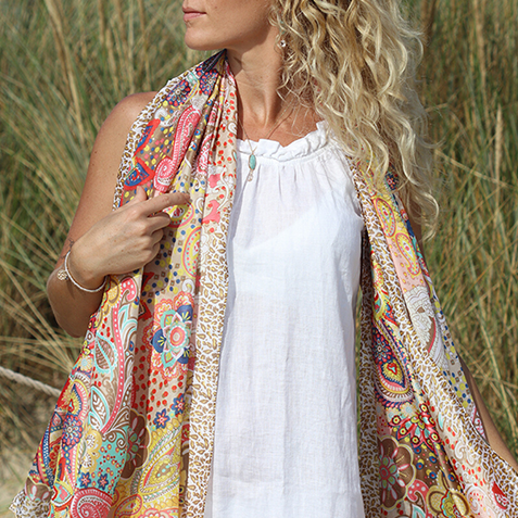 Women in a silky paisley print scarf