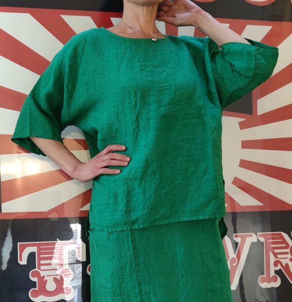 Green linen easy shaped top with side slits and elbow length sleeve