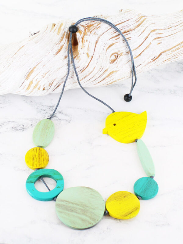 A wooden assorted shape necklace with a chubby bird at the top in shades of lemon, mint and aqua
