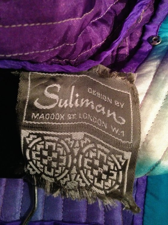 Label from hand painted silk gown by Design by Suliman