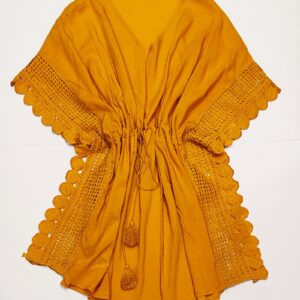 A mustard coloured kaftan with drawstring waist and deep crochet trim on the edges, against a plain white background