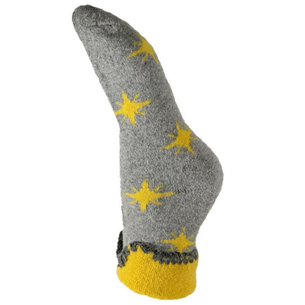 A single wool sock in grey with mustard coloured stars, a yellow turn back cuff finished with a blanket stitched edging