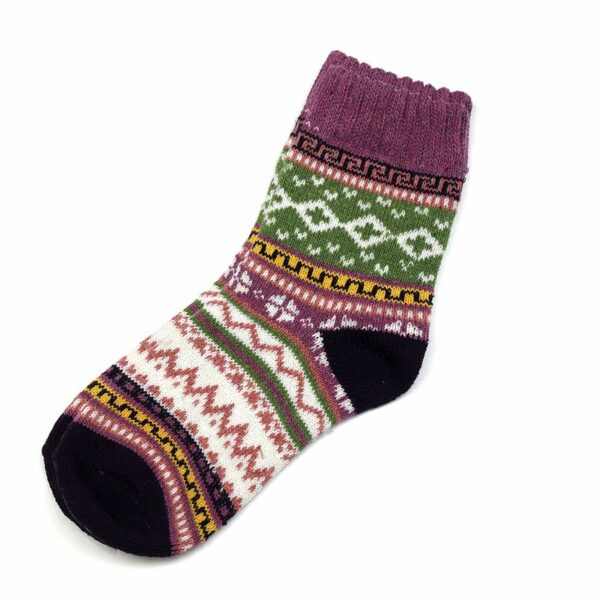 a single sock on a white background with a nordic style multicoloured pattern