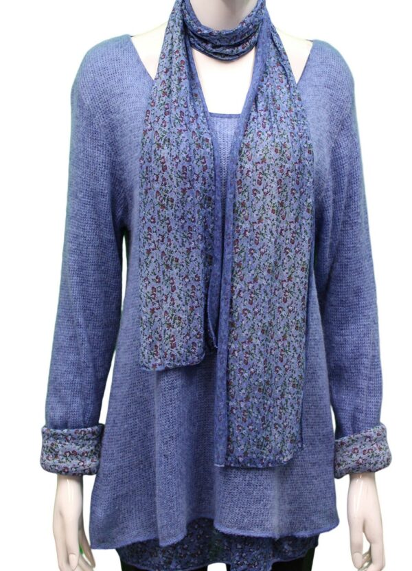 a blue mohair jumper with a printed floral jersey under layer and matching floral scarf