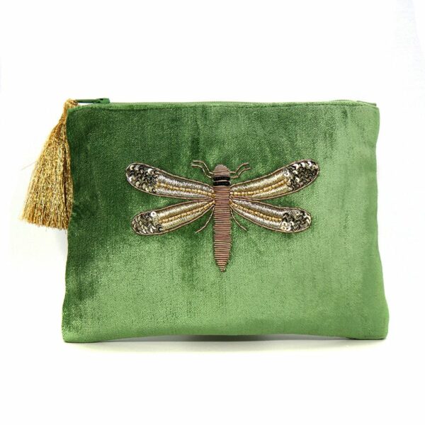 a green velvet cosmetic style bag with a large golden dragonfly embroidered on the front side. A large gold tassle closes the zip at the top