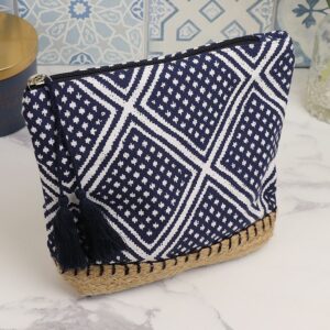 a diamond printed cotton wash bag in navy and white with a natural sisal trim along the bottom edge, finised wit a navy double tassle