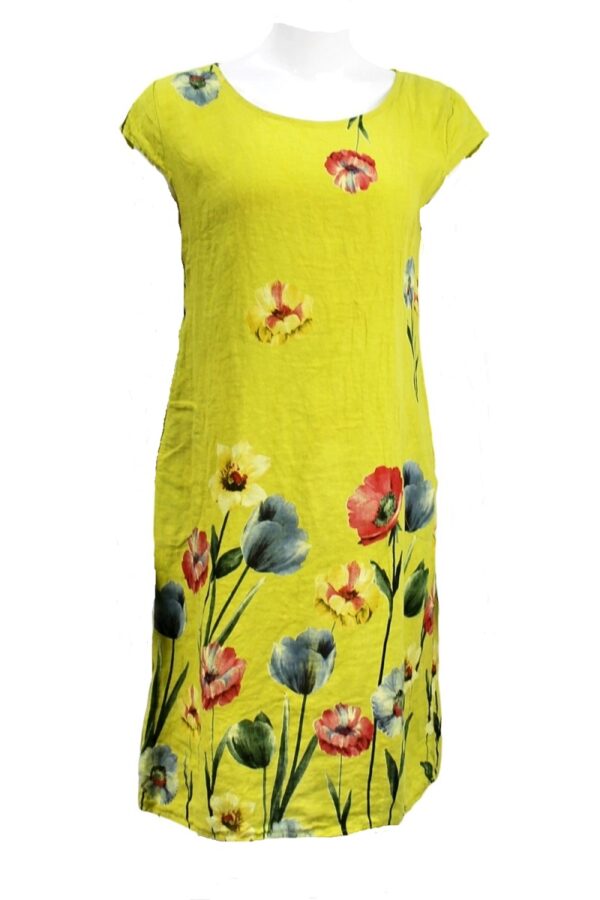 a straight cut linen dress with cap sleeves and a large floral print along the bottom half in yellow, blue and red