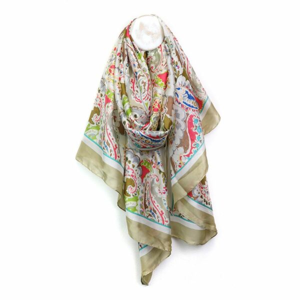 a satin scarf with taupe border and a paisley print in green, pink and blue shown twisted on a wooden hook