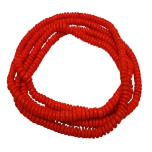 A string of red wooden disc beads made into a long necklace shown twisted 3 times on a white surface
