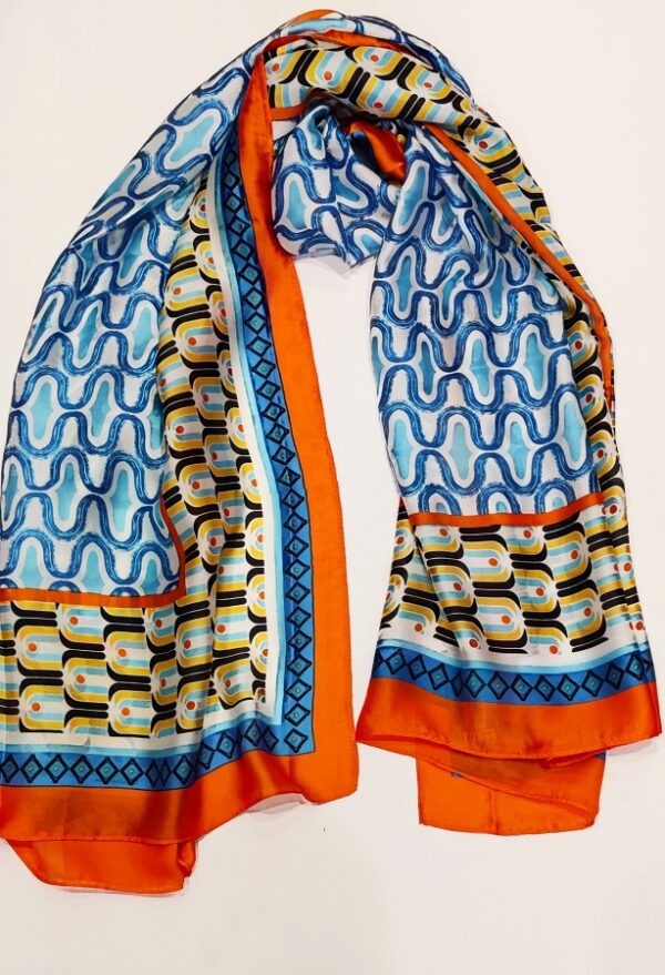 a satin scarf with a bold print of blue wavy tile design bordered by an arched design in gold and black all edged with a bright orange border on all sides