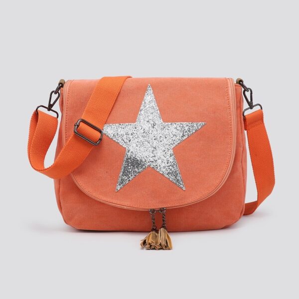 a large orange canvas crossbody bag with a silver star emblem on the front flap and tassles on the zip ends with a webbing strap