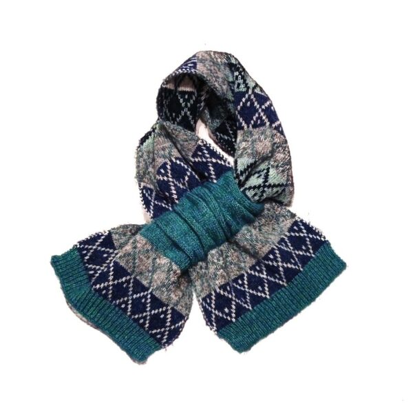 a teal and grey fairisle knit scarf shown twisted and looped through it's funnel opening on a white background